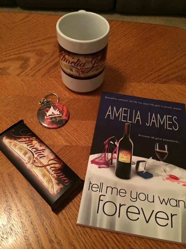 Signed paperback, coffee mug, chocolate bar, and keychain